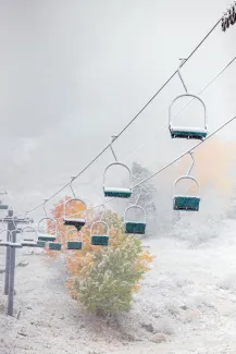Aspen Chairlift in the snow with fall leaves
