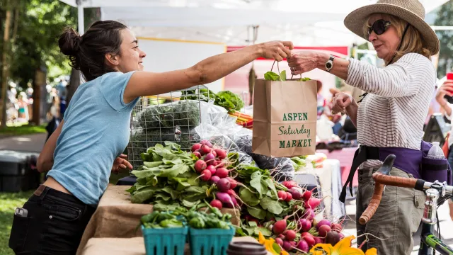 Aspen Saturday Market exchange of vegetables 