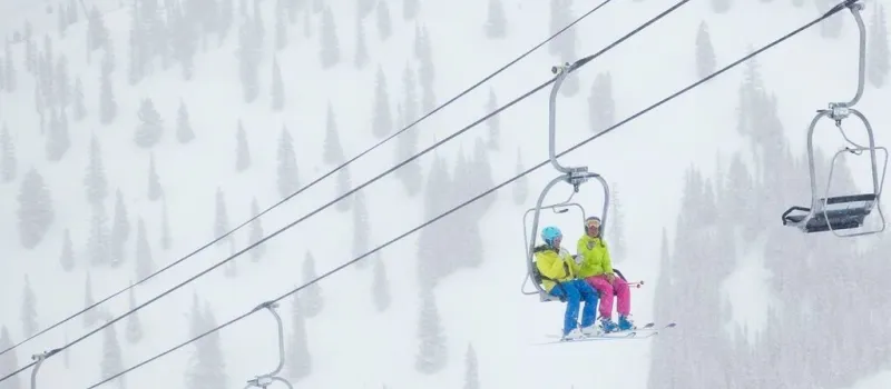skiers chairlift AspenMountain