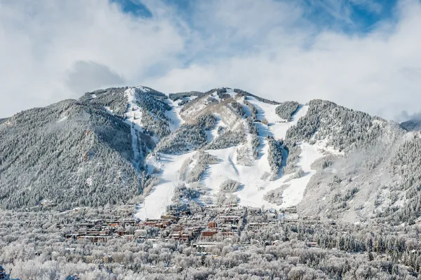 A winter scenic view of the town of aspen and aspen mountain