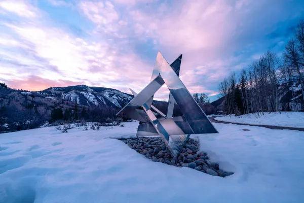 aspen meadows sculpture on campus with beautiful night sky