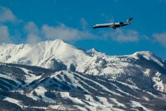 winter ASE airplane landing