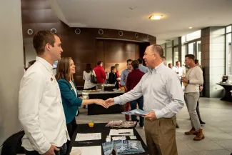 people shaking hands and networking