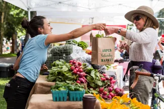 Aspen Saturday Market exchange of vegetables 