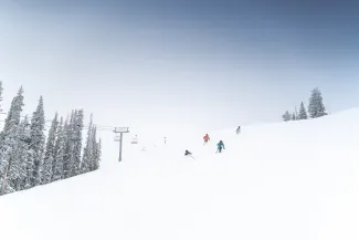 skiers on the mountain
