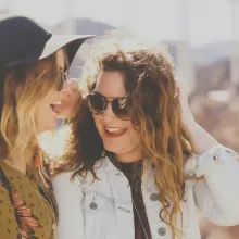 Women laughing and enjoying a day of shopping